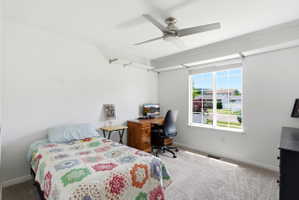 Bedroom with neutral carpet flooring and white walls