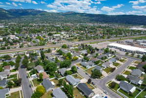 Residential neighborhood featuring established trees and a distant mountain backdrop
