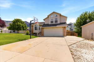 Two-story residence featuring a two-car garage and a concrete driveway