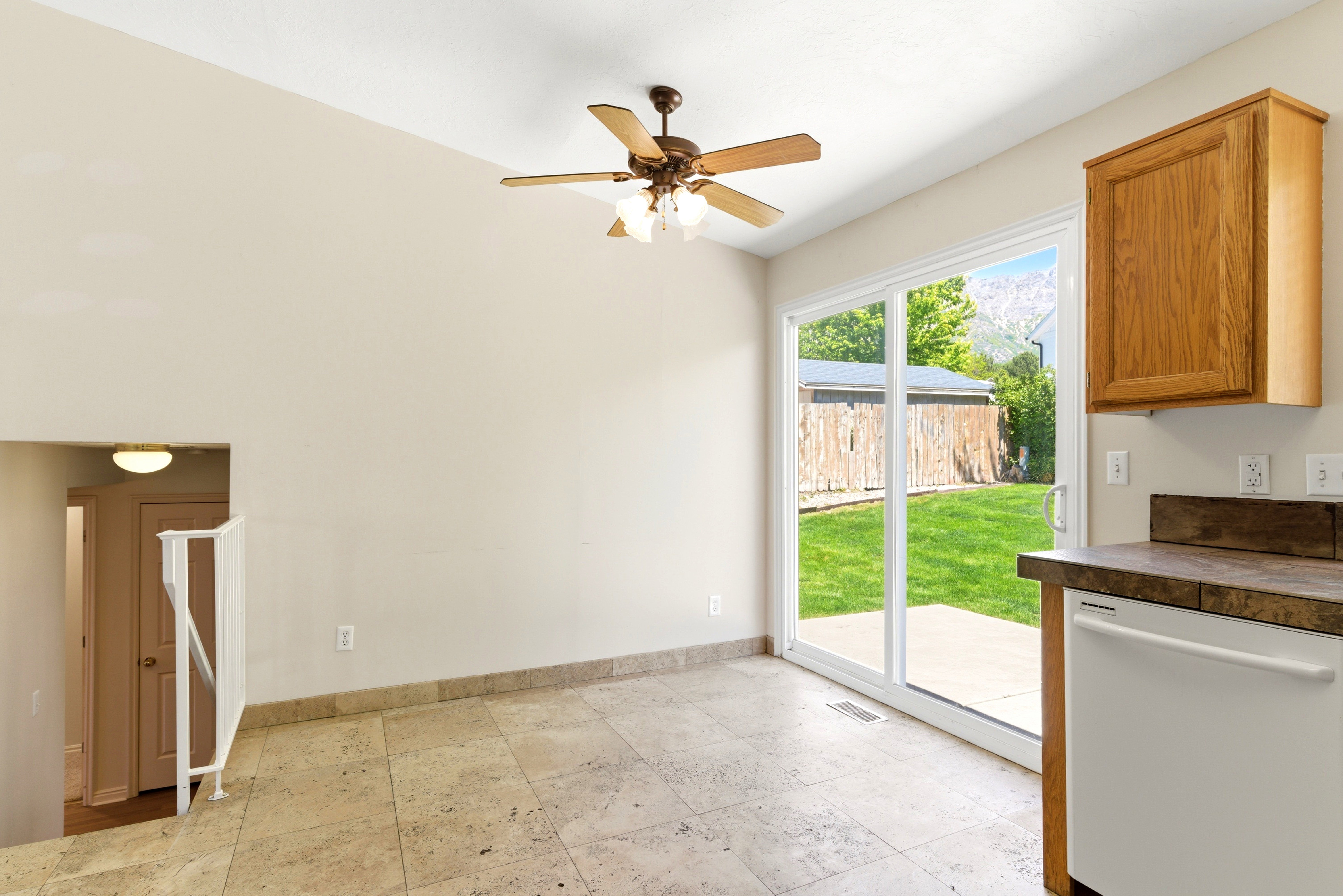 Tile flooring and light wall tones provide a neutral backdrop for the dining area