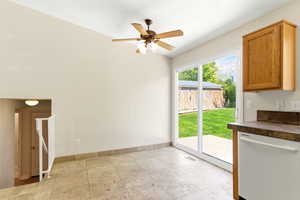 Tile flooring and light wall tones provide a neutral backdrop for the dining area