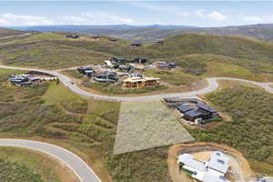 Expansive hillside lot featuring natural vegetation and surrounding mountain terrain