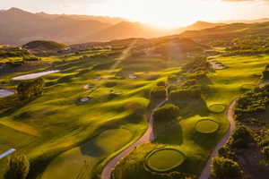 Expansive golf course with manicured greens and fairways