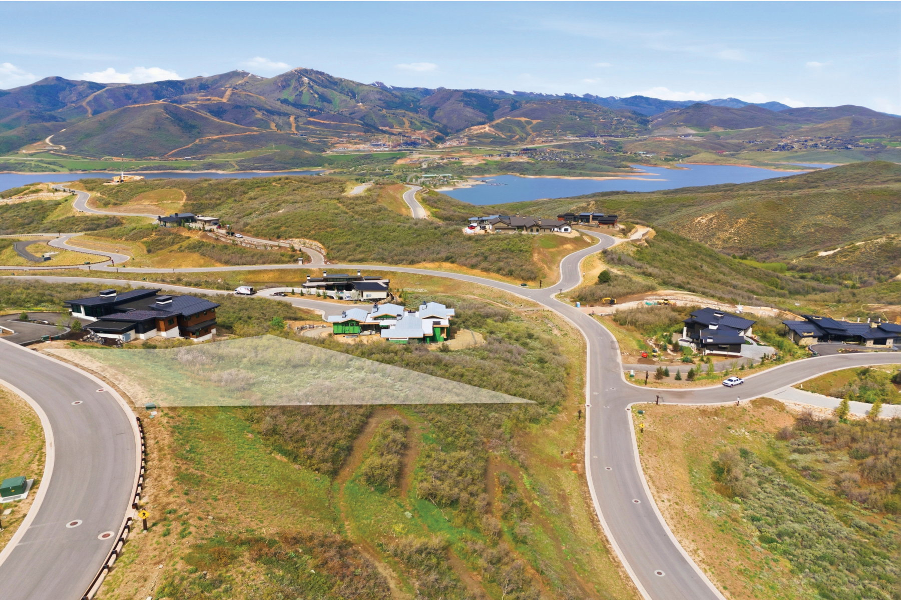 Expansive hillside lot with mountain and reservoir backdrop