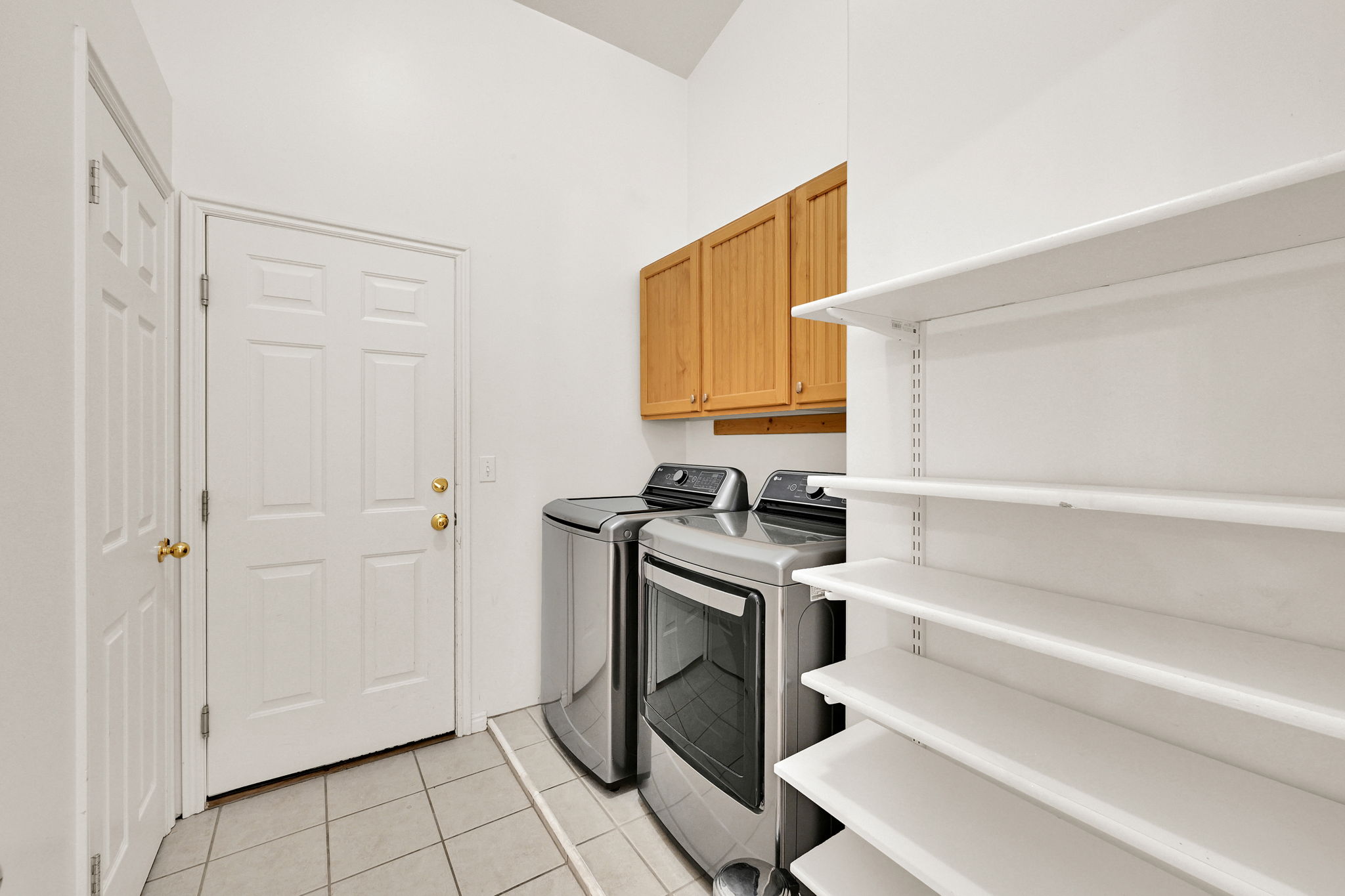 Practical utility area featuring durable tile flooring