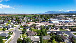 Residential neighborhood featuring established homes with mature trees and paved streets