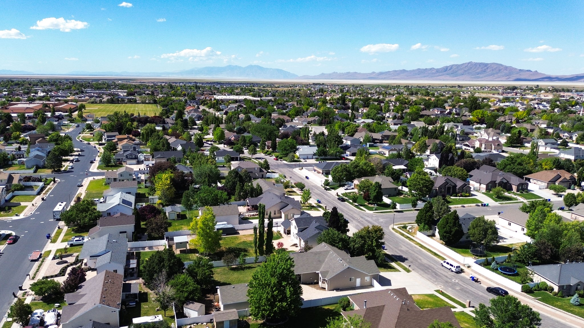 Expansive residential area featuring numerous single-family homes, mature landscaping, and paved streets