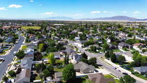 Expansive residential area featuring numerous single-family homes, mature landscaping, and paved streets