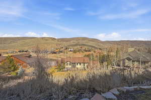 Expansive mountain terrain with scattered residential properties