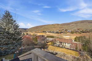 Expansive mountain landscape with scattered residential properties