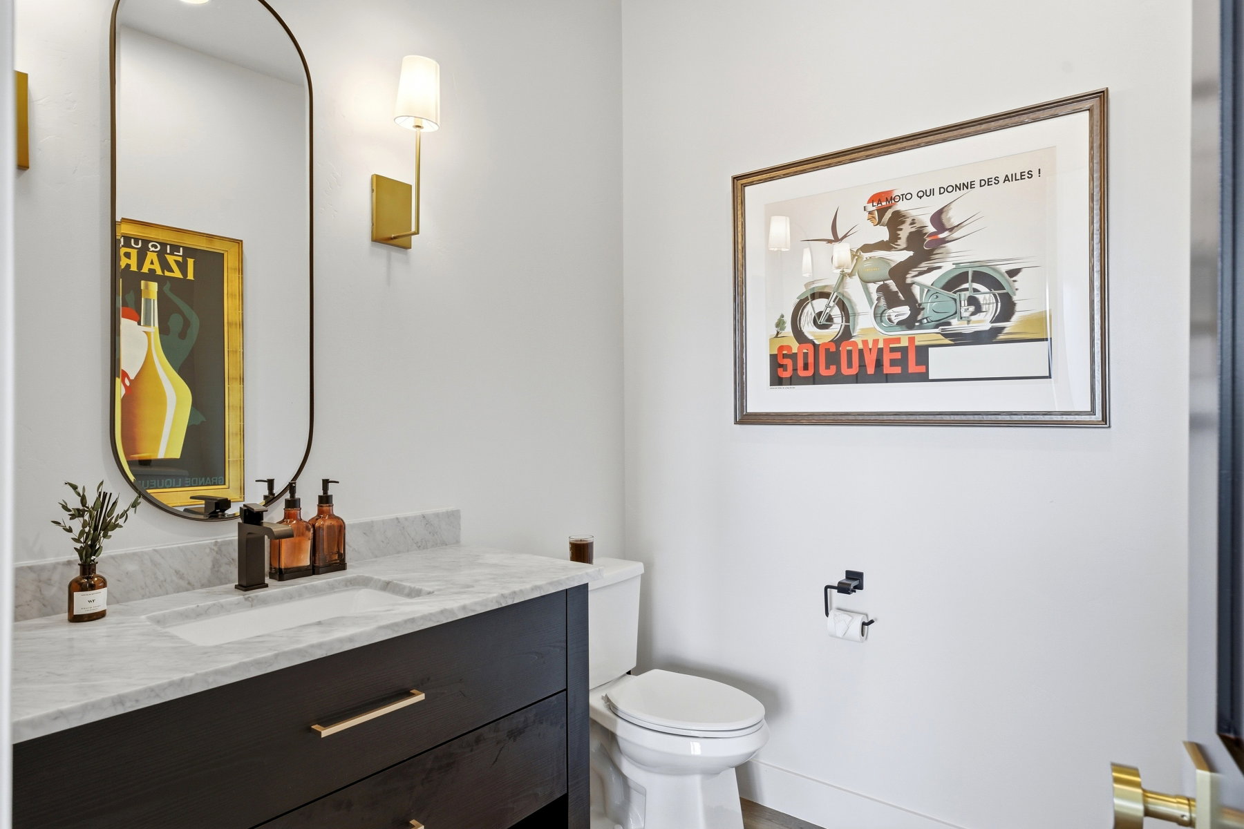 Vanity featuring a stone countertop, integrated rectangular sink, and matte black faucet