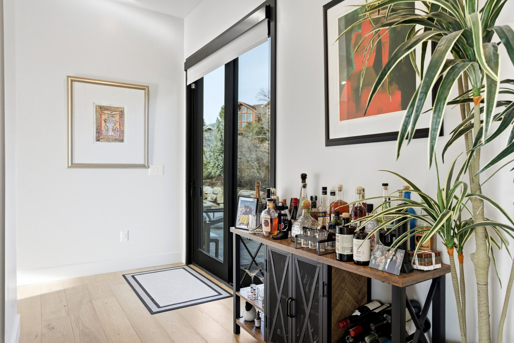 Light wood-finish flooring complements white walls