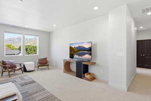 Carpeted room featuring multiple windows with mountain and tree scenery