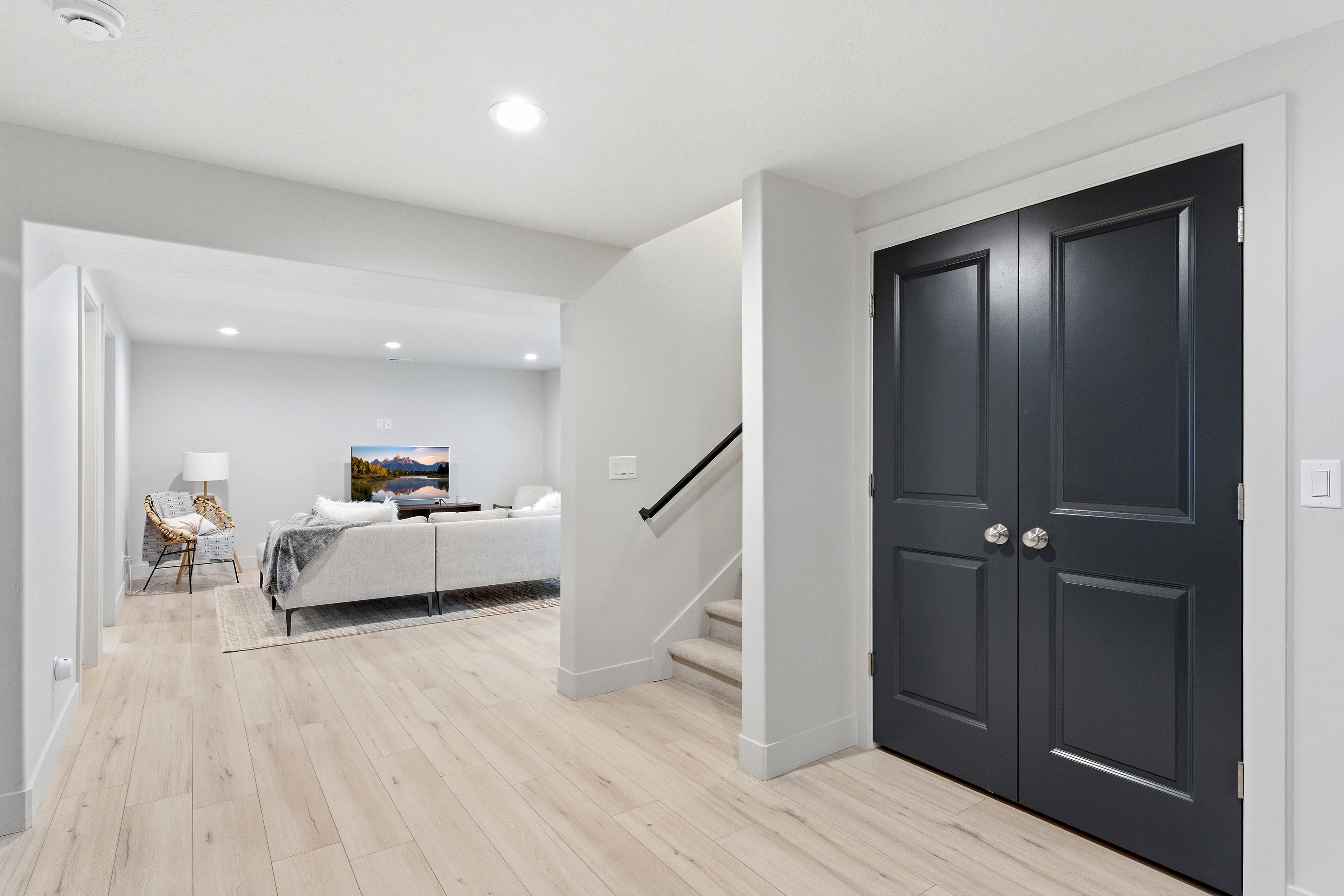 Light LVP-finish flooring throughout, complemented by crisp white trim
