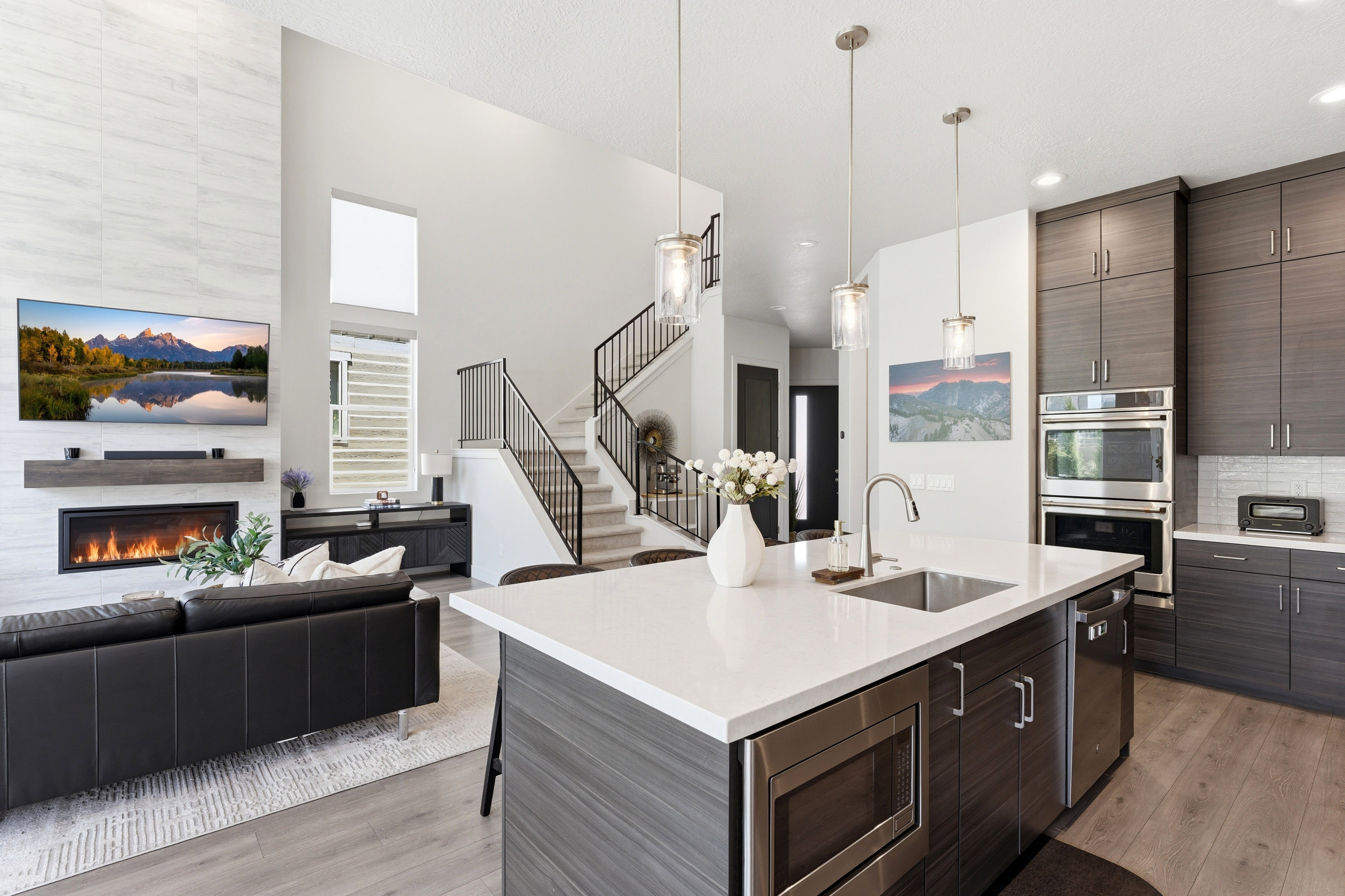 Open-concept living space featuring LVP-finish flooring throughout