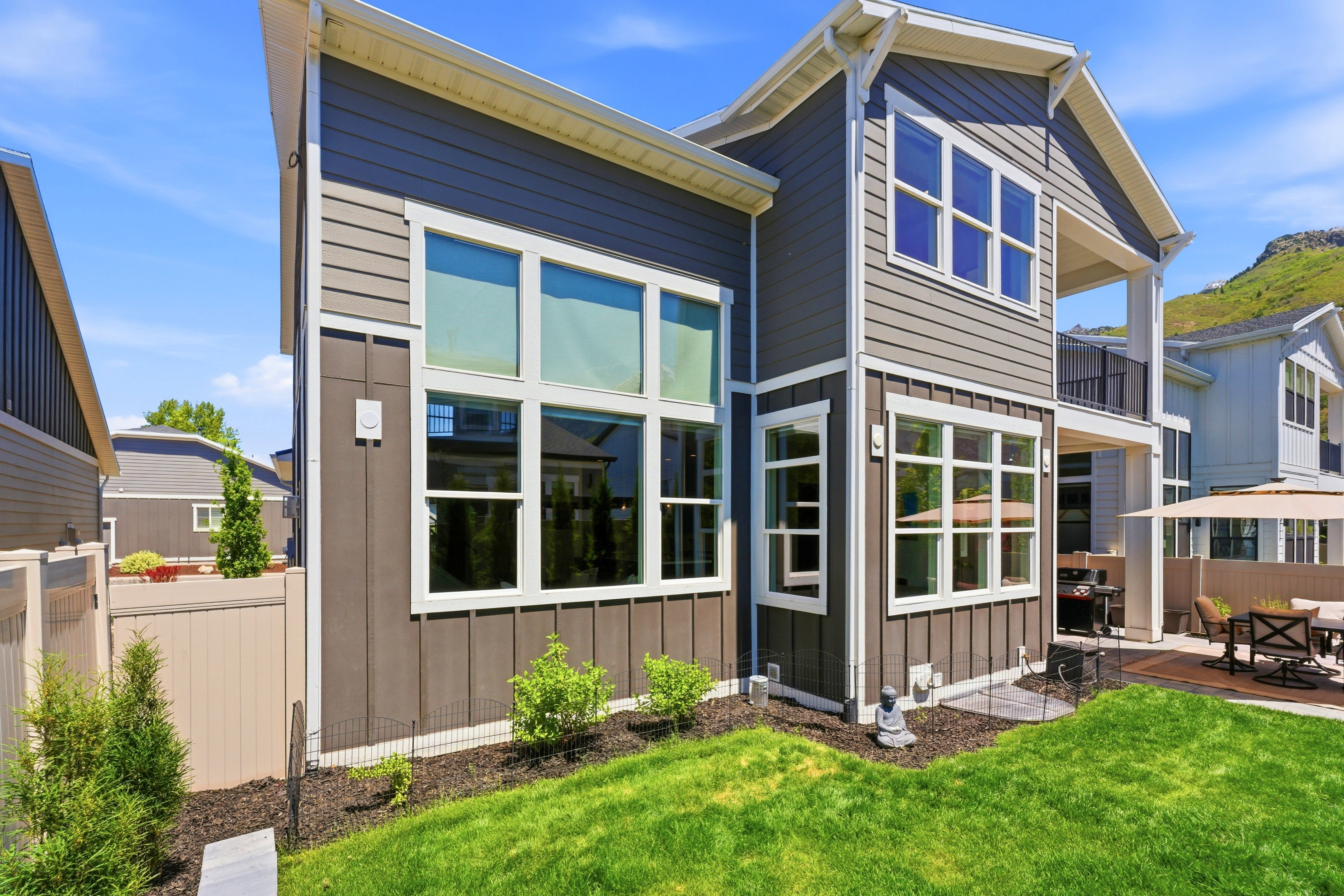 Contemporary exterior featuring multi-level siding and white trim