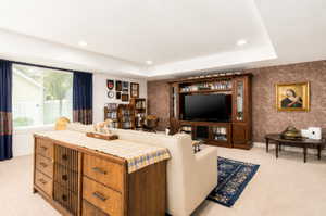 Spacious room featuring recessed lighting and a large window with horizontal blinds