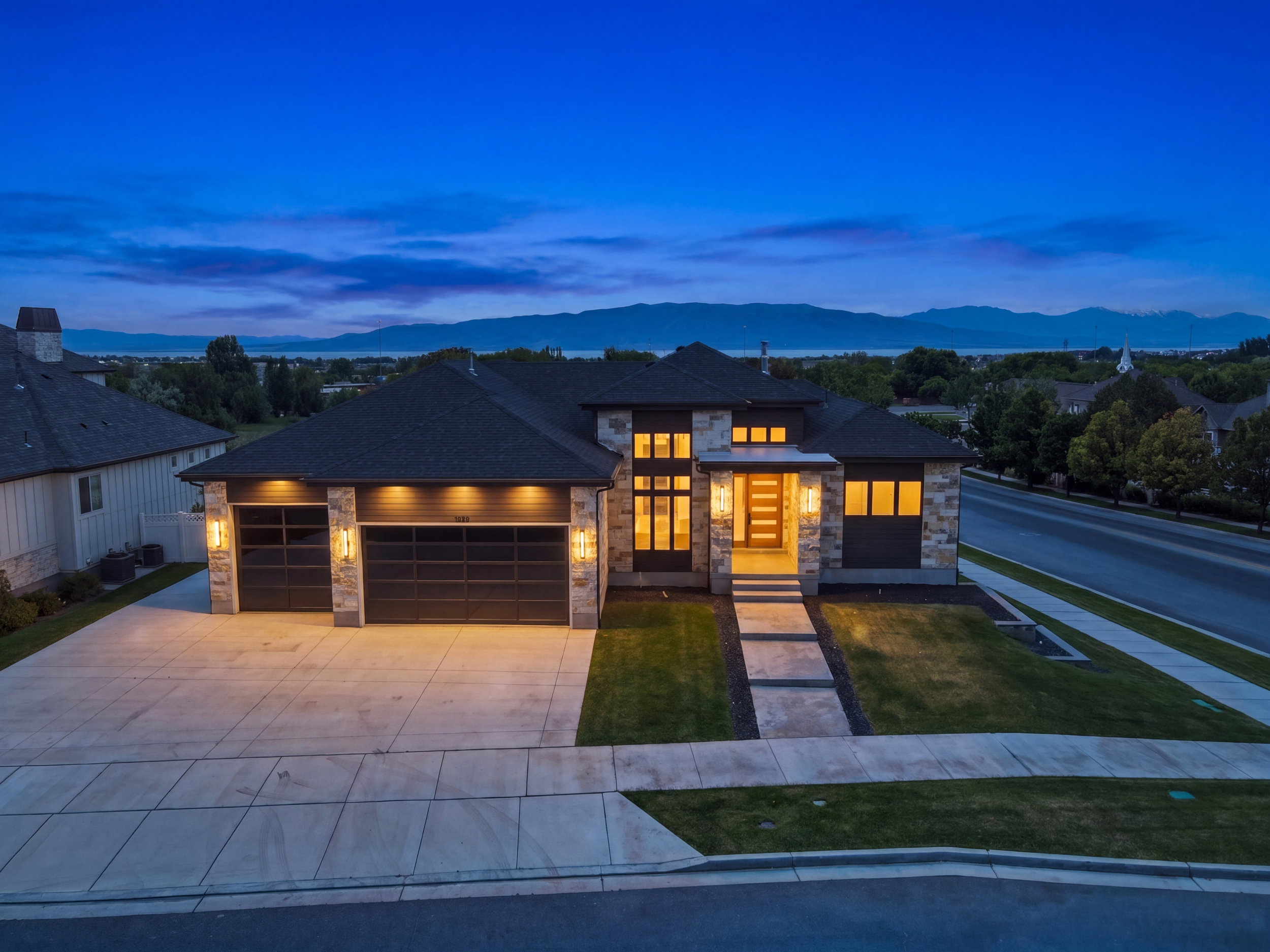 Contemporary two-story exterior with stone and siding accents