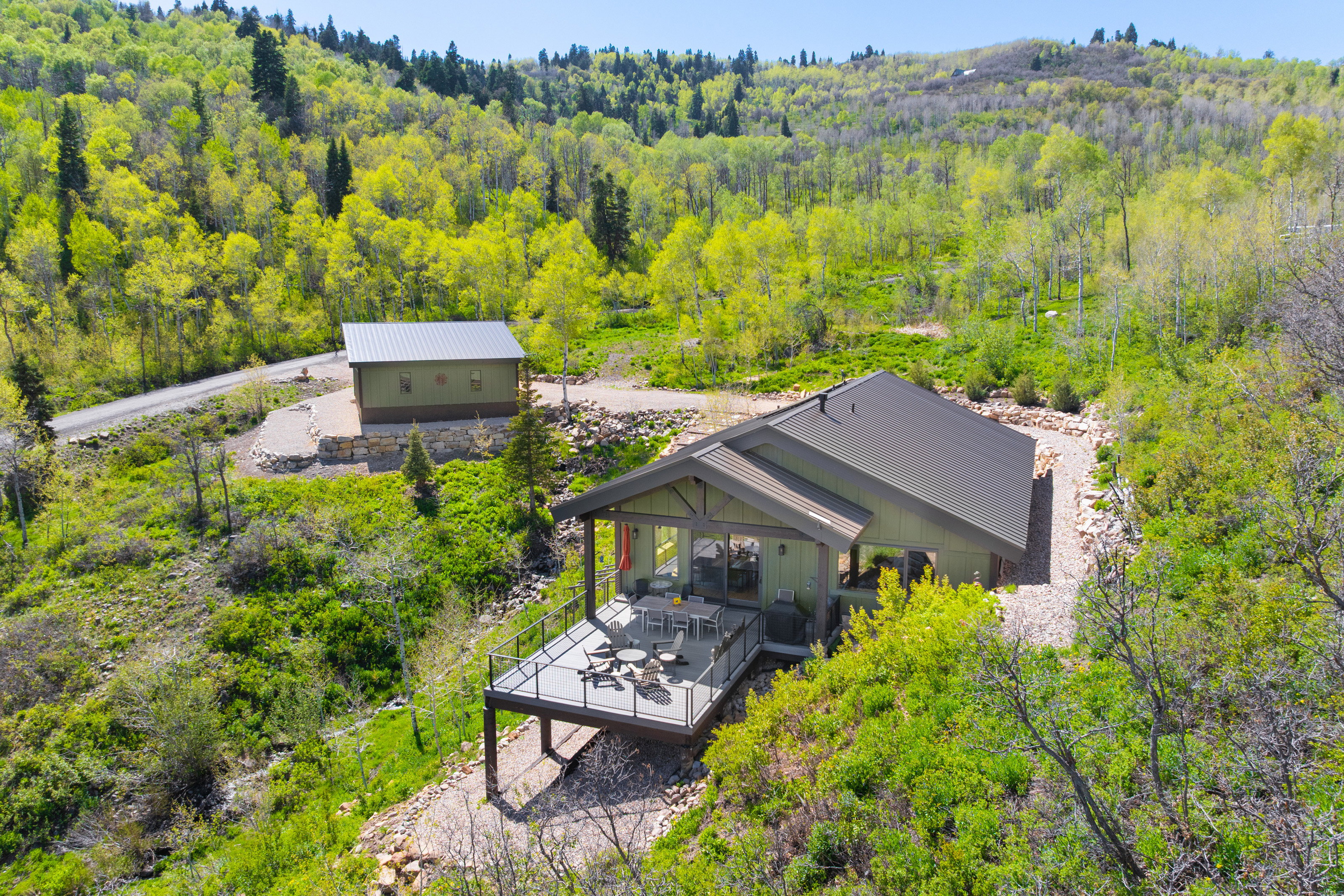 View from above of property with a heavily wooded area