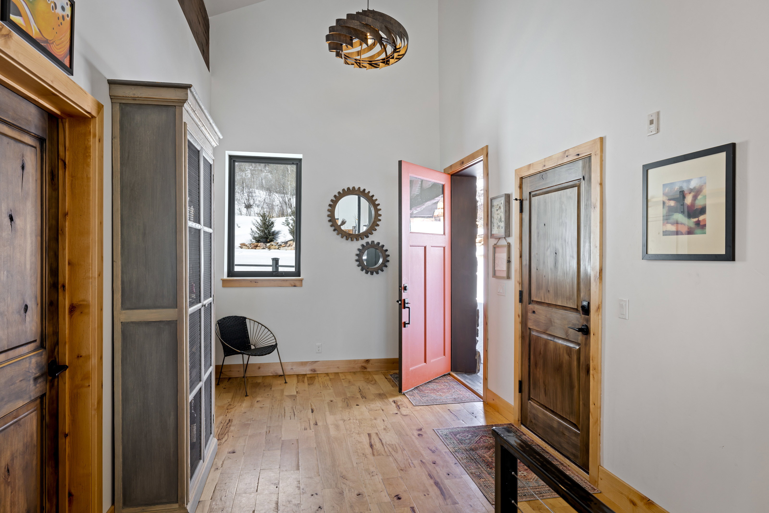 Foyer featuring light wood finished floors and a high ceiling