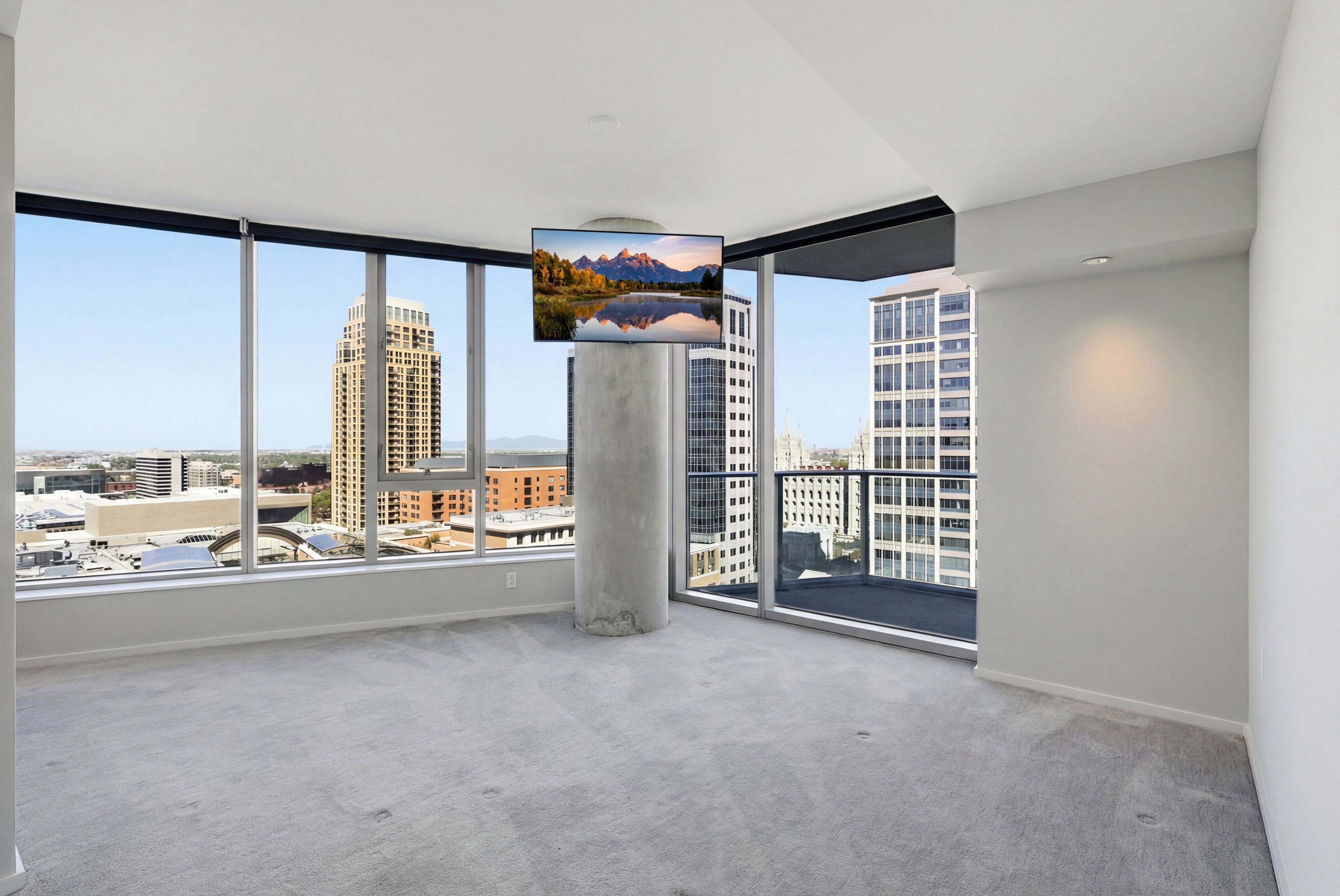 Floor-to-ceiling windows with roller shades