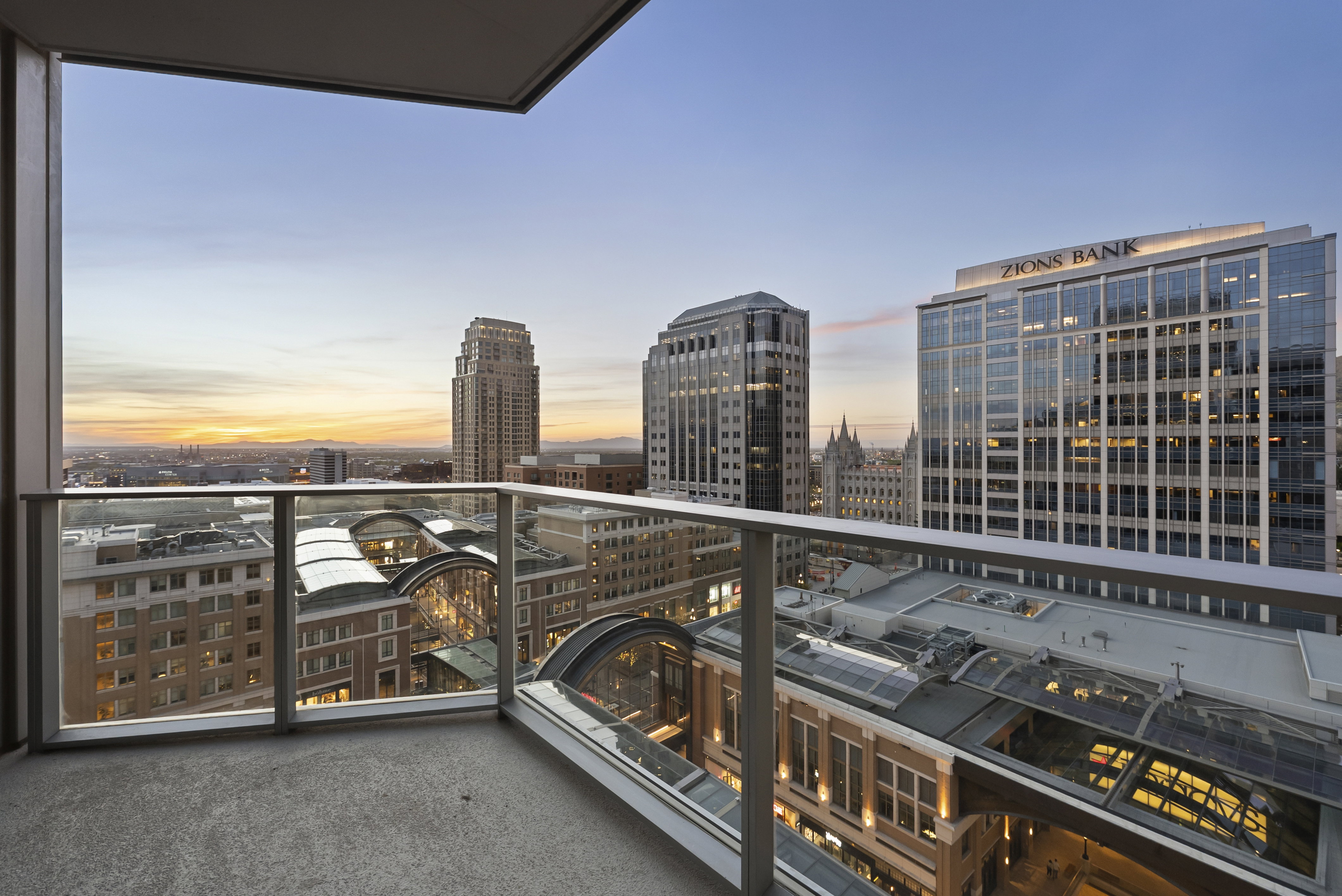 Balcony with concrete flooring and glass railings