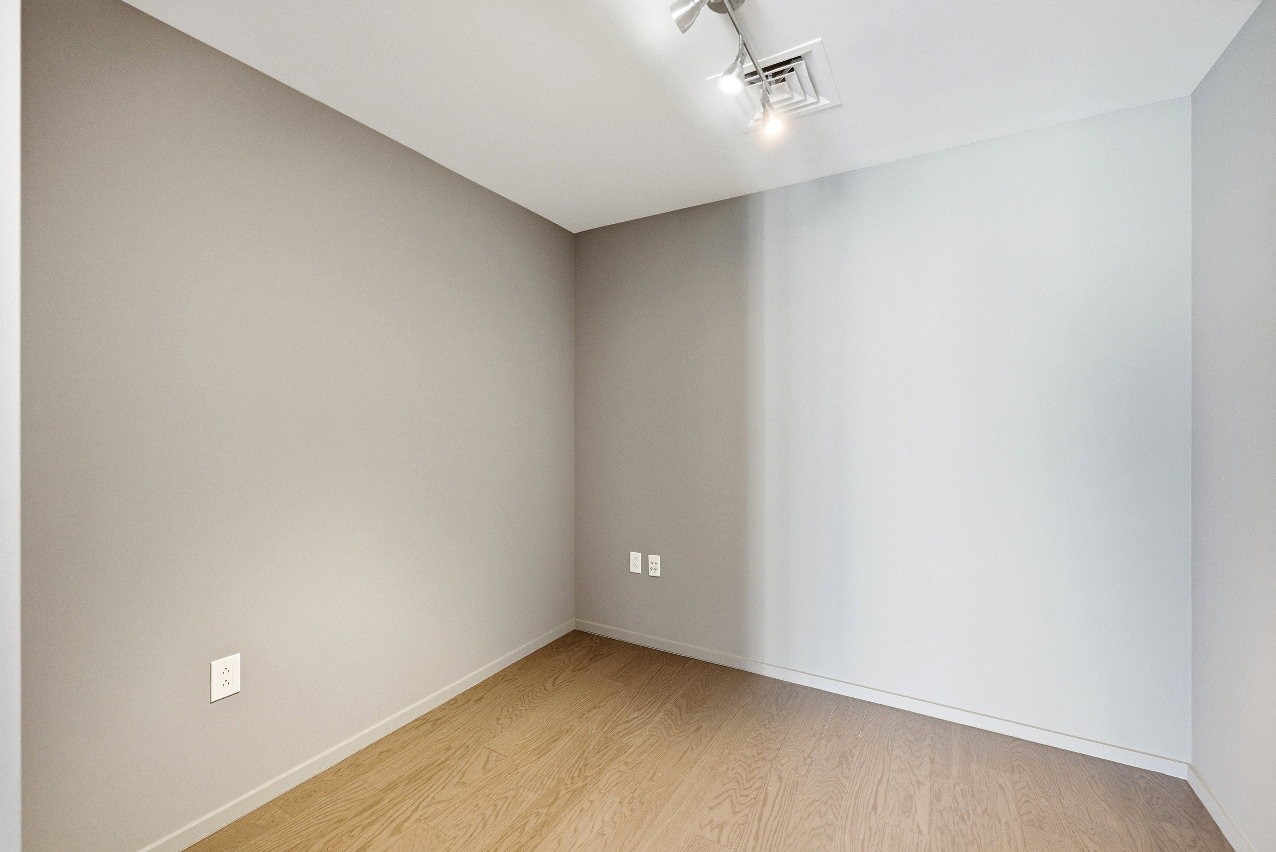 Neutral-toned room with wood-finish flooring