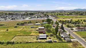 Expansive agricultural land featuring a barn and additional outbuildings