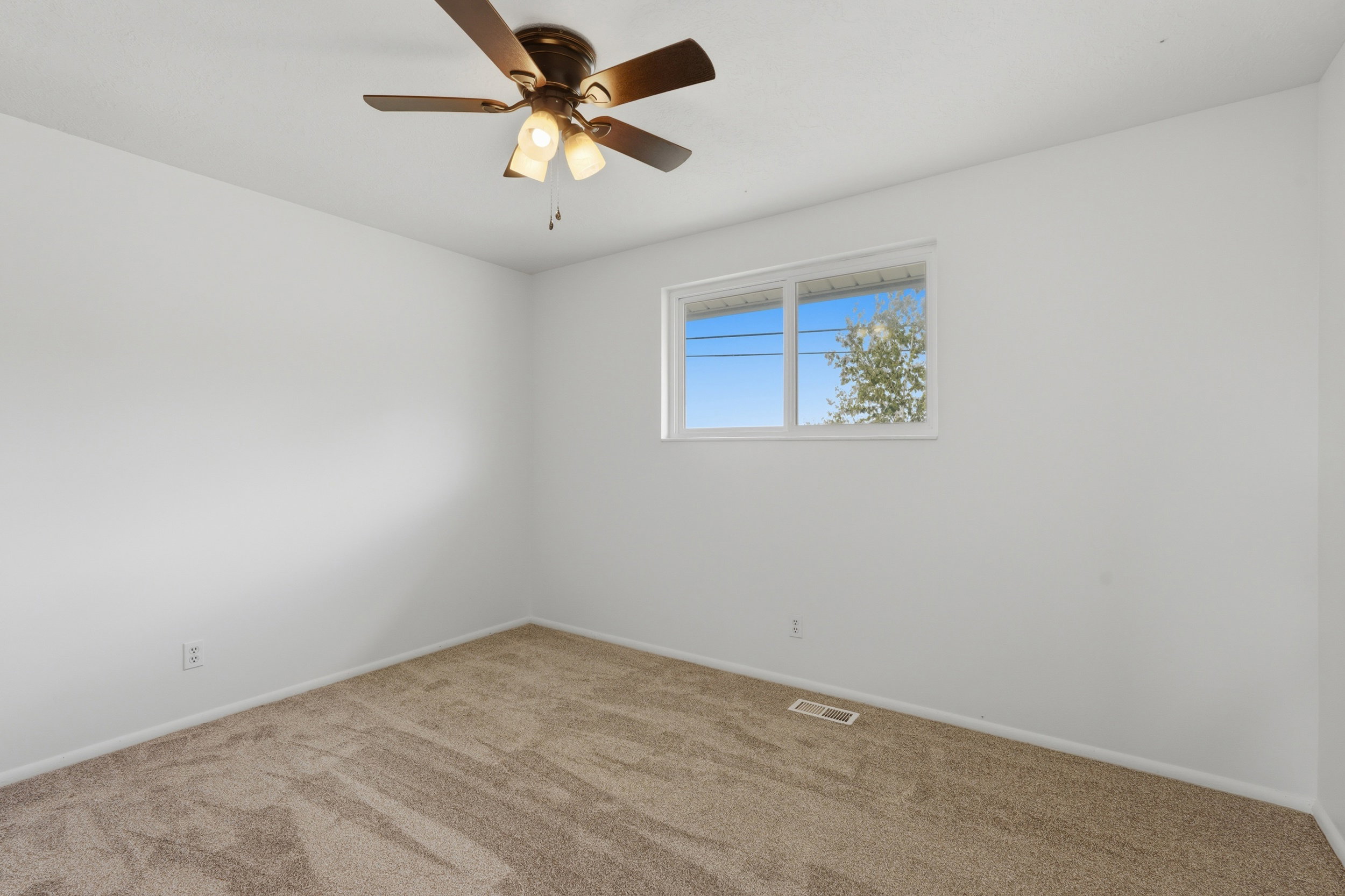 Neutral tone wall finish with a double-pane window