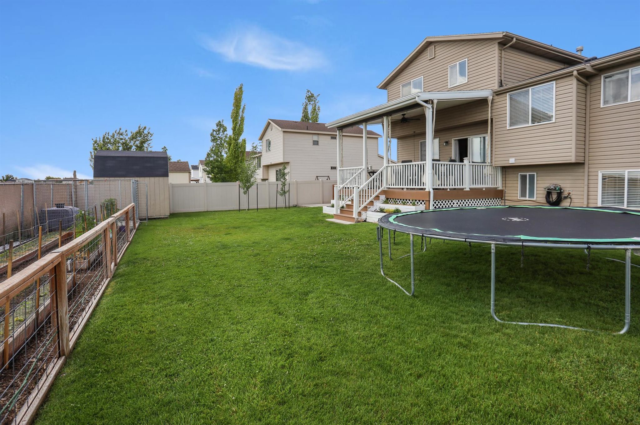 Back Yard, vegetable garden area, covered deck and patio