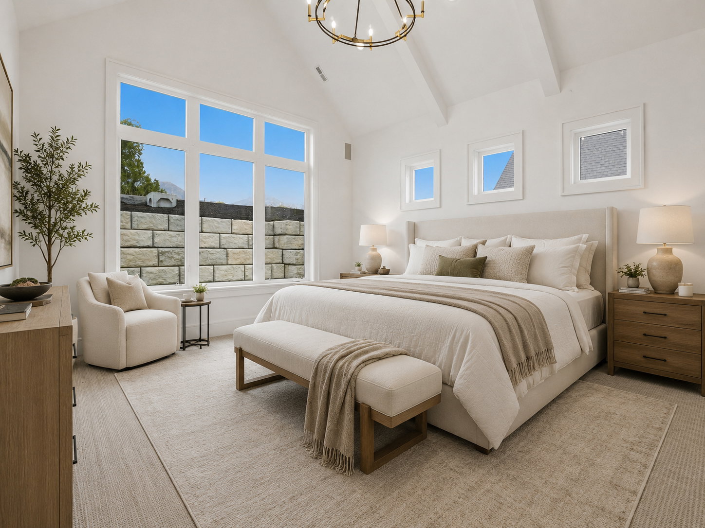 Spacious room featuring a prominent vaulted ceiling with exposed beams, large picture windows, wood-finish flooring, and additional square accent windows