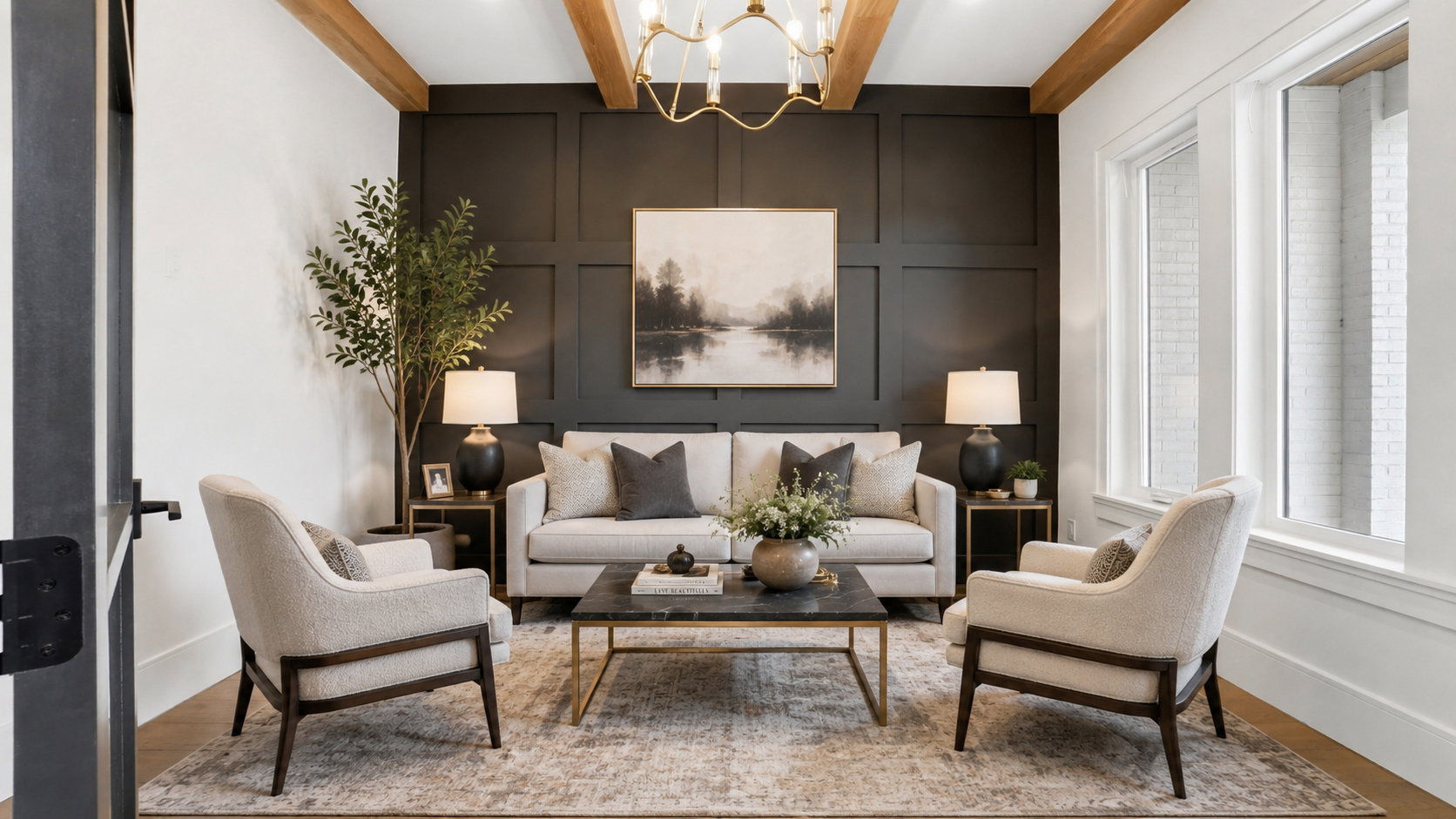 Living area featuring a paneled accent wall, exposed wood-finish ceiling beams, and a brass chandelier