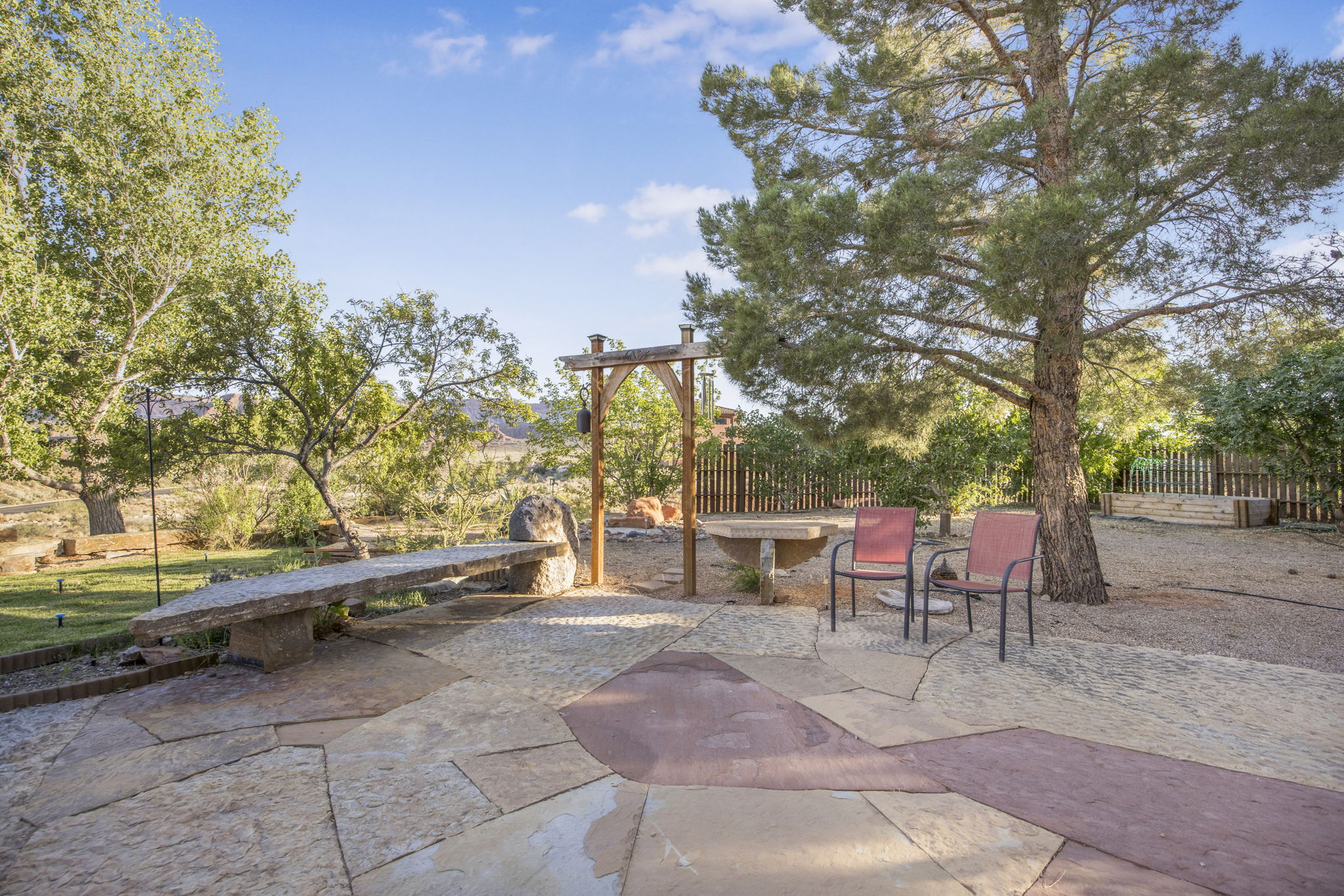 Expansive flagstone patio featuring varied stone colors