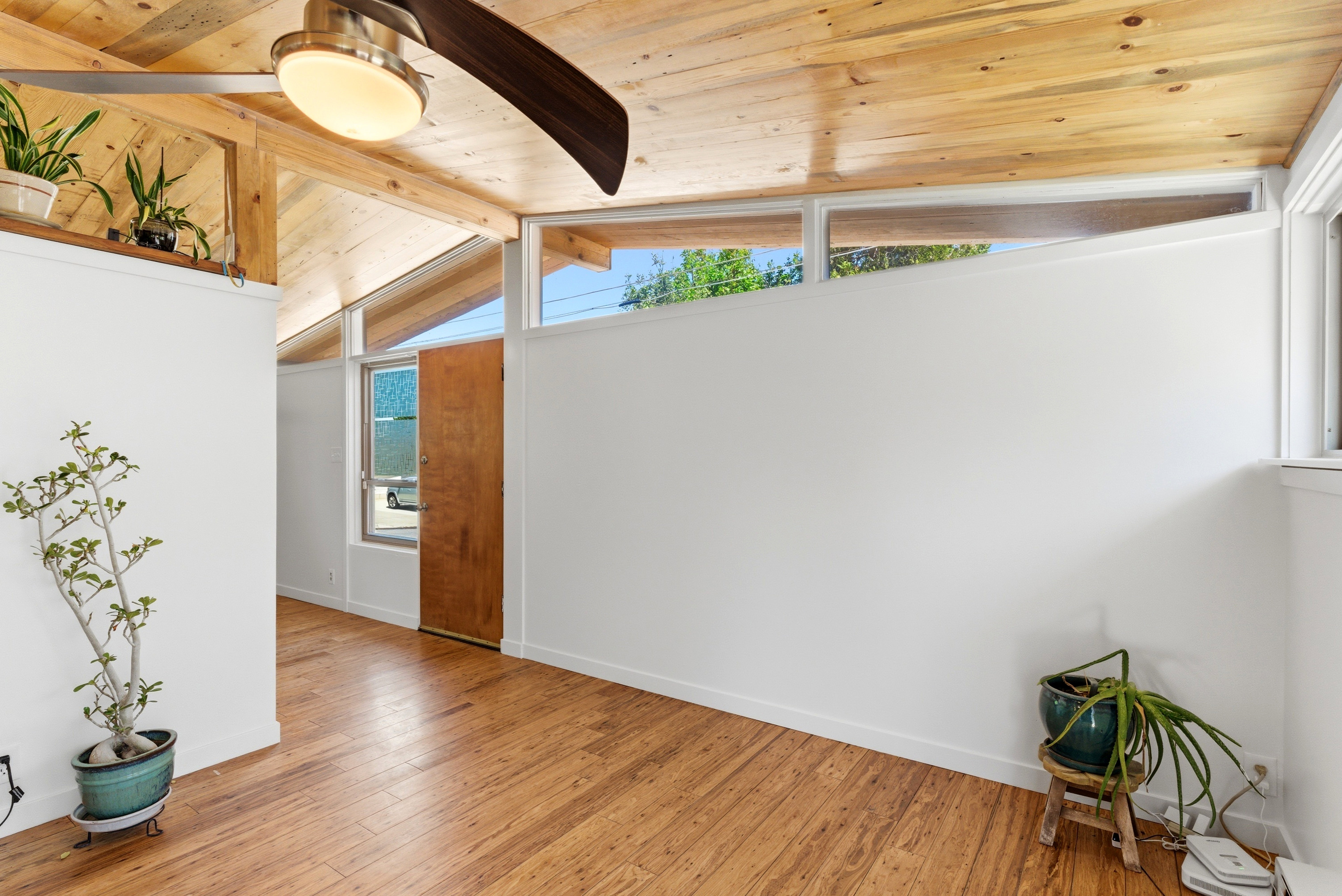 Vaulted wood-paneled ceiling with exposed beams