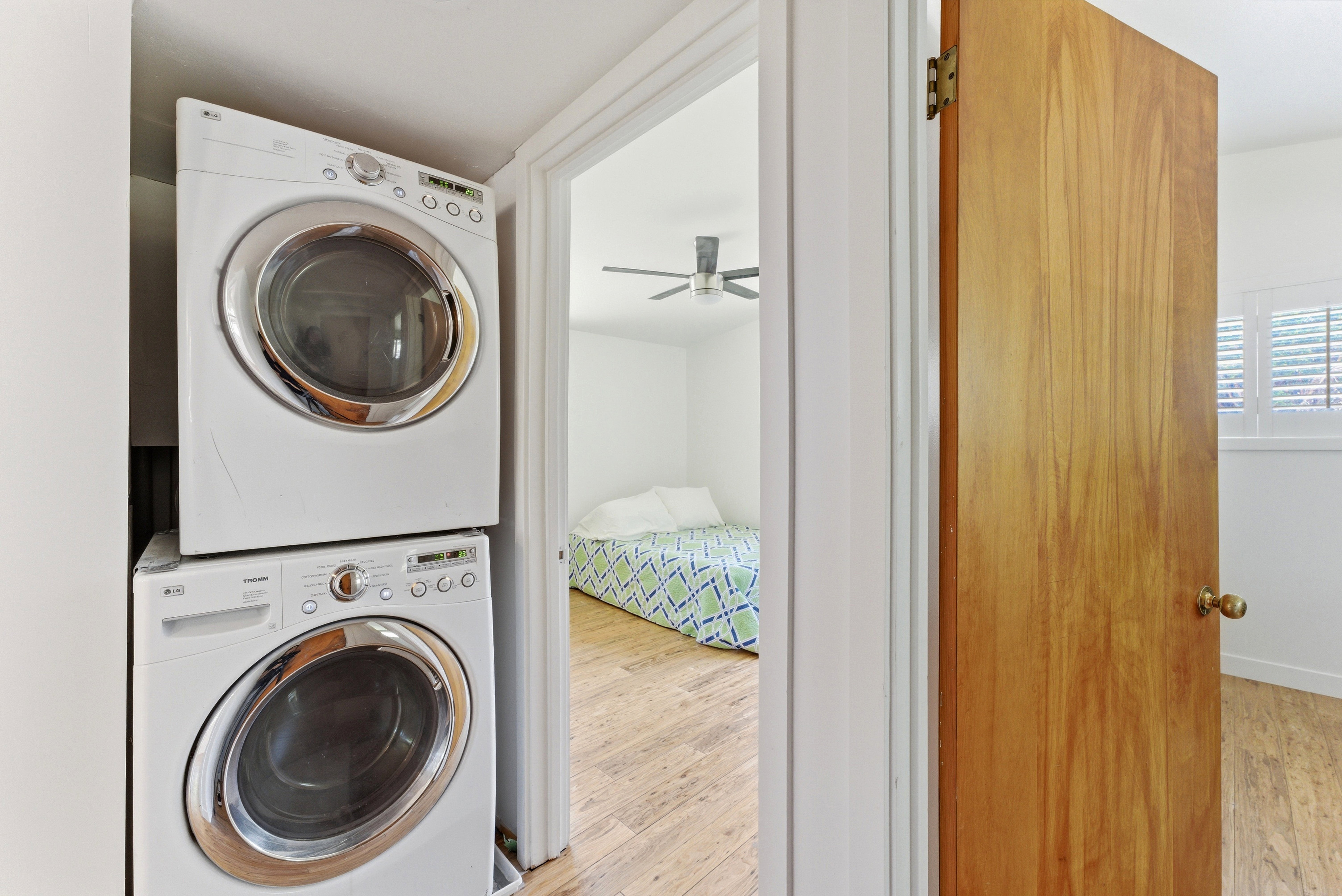 Stackable front-loading washer and dryer in a dedicated laundry area