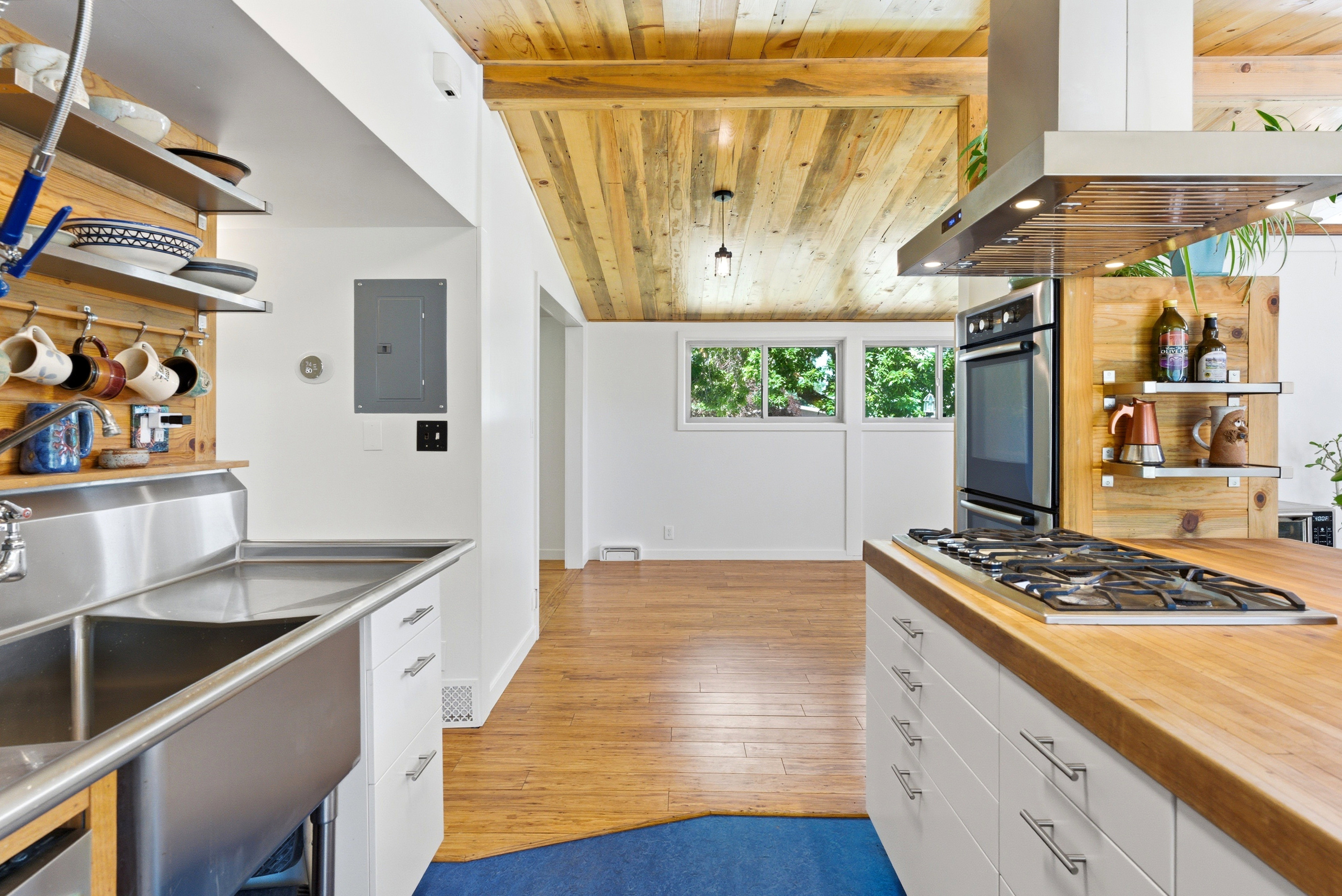 Kitchen featuring a wood-finish plank ceiling and hardwood flooring