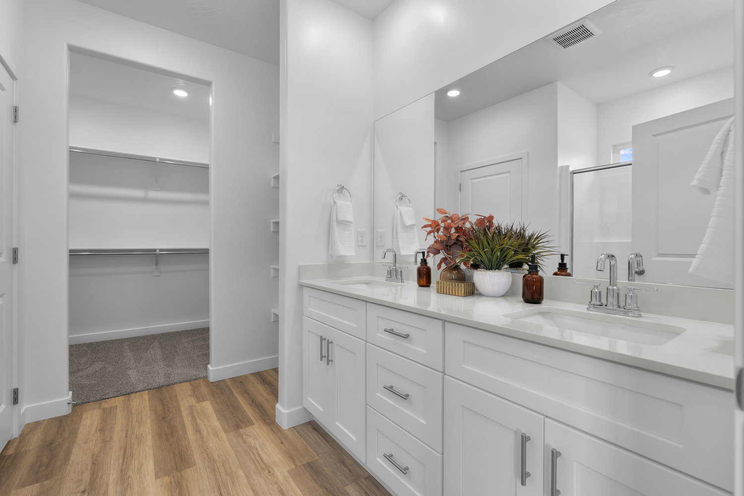 Dual vanity with undermount sinks and chrome fixtures