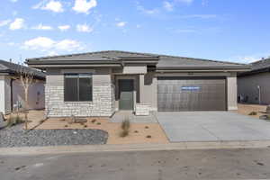 Modern single-story residence with a stucco and stone veneer facade