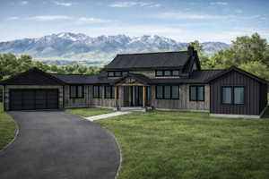 Contemporary farmhouse exterior featuring vertical wood siding and a dark metal roof