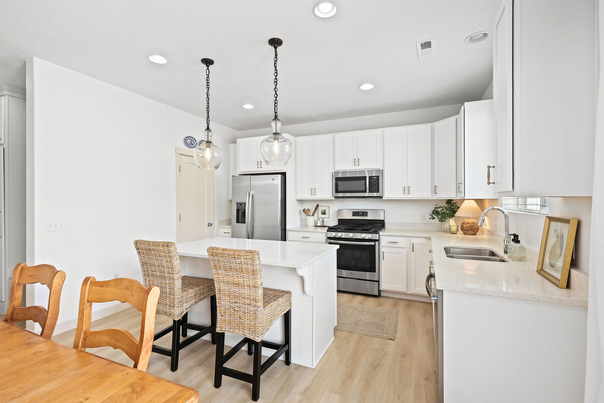 Modern kitchen with a central island featuring pendant lighting