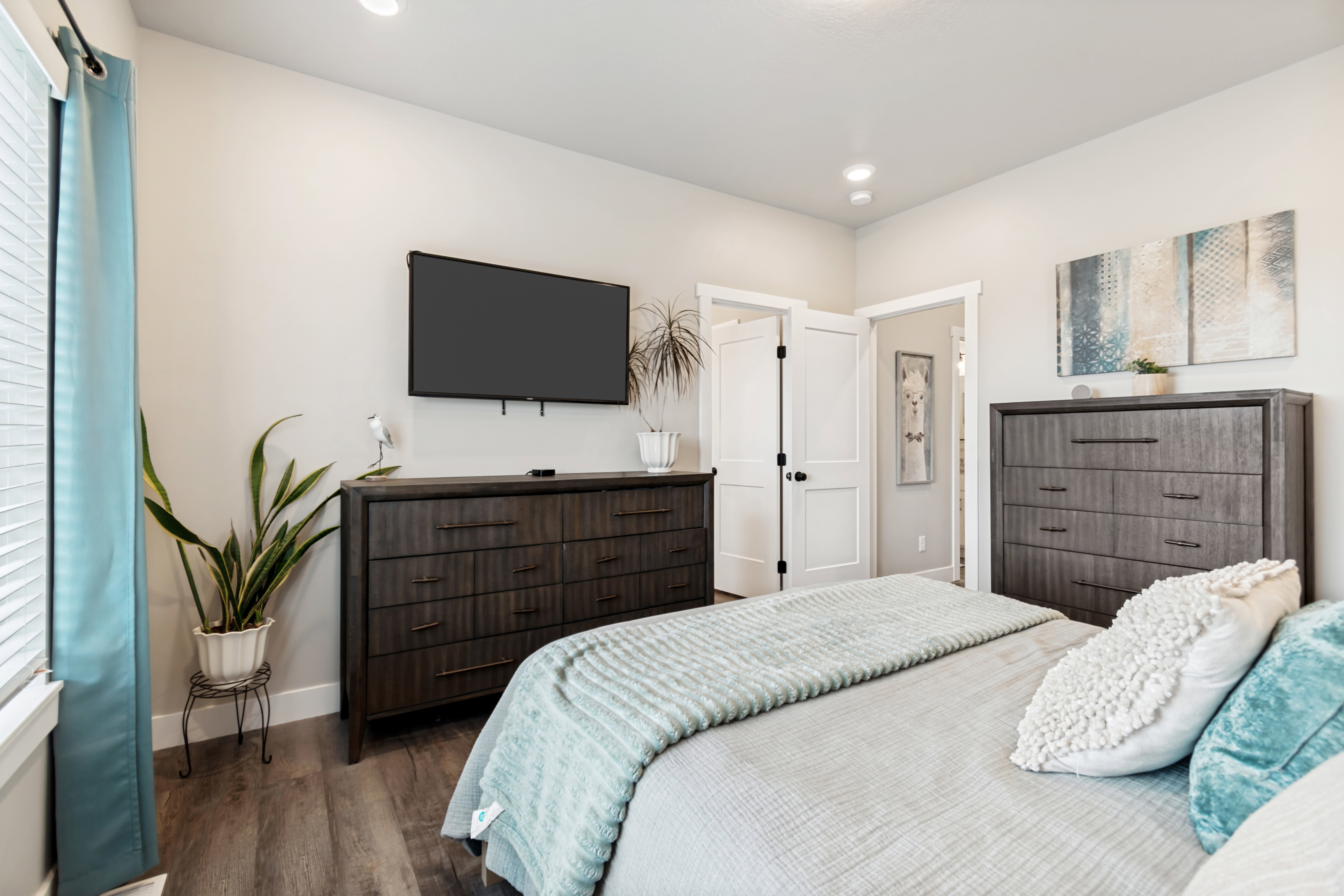 Bedroom featuring wood-finish flooring, recessed lighting, and white trim