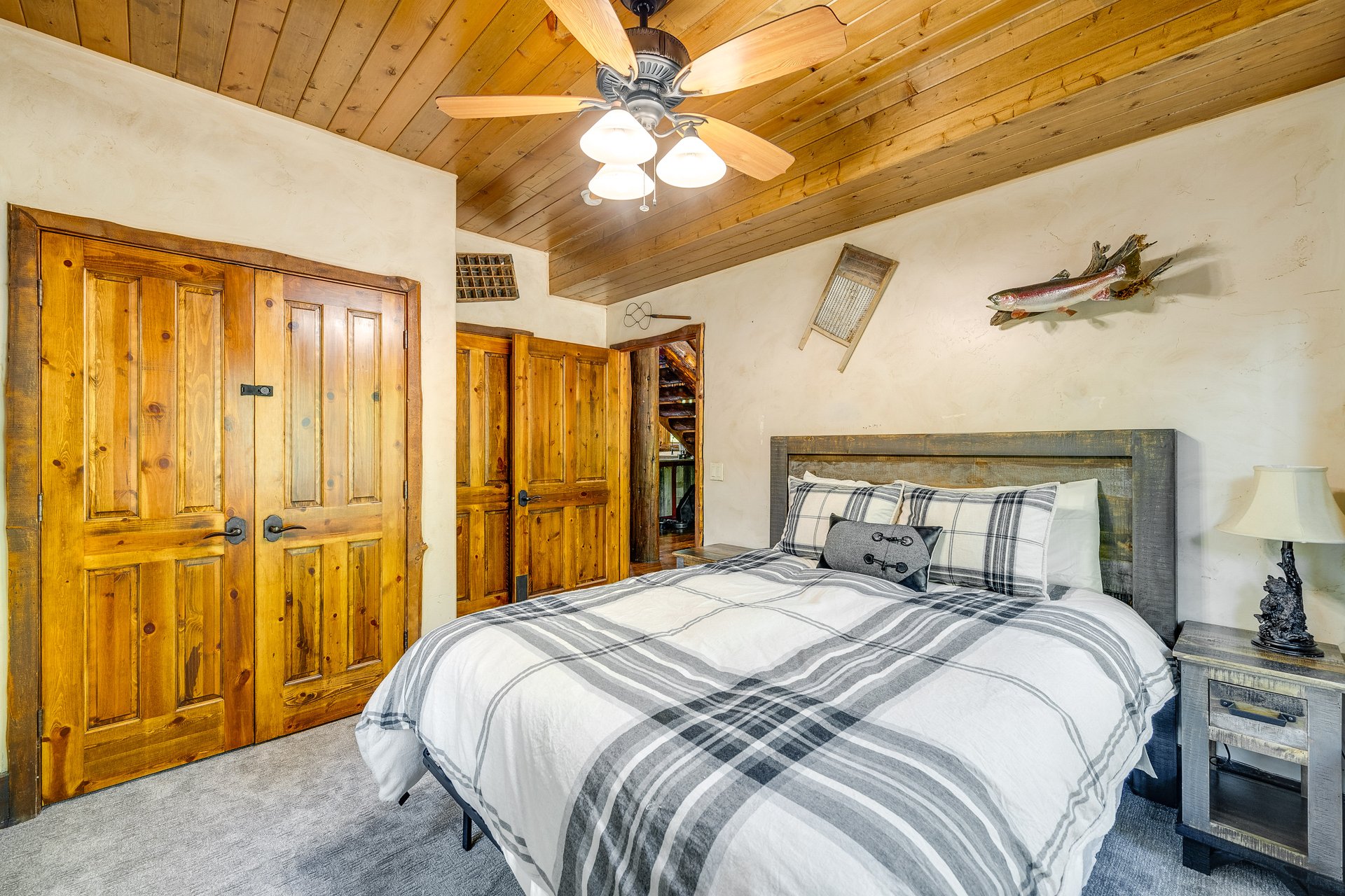 Wood-finish plank ceiling with a ceiling fan light fixture