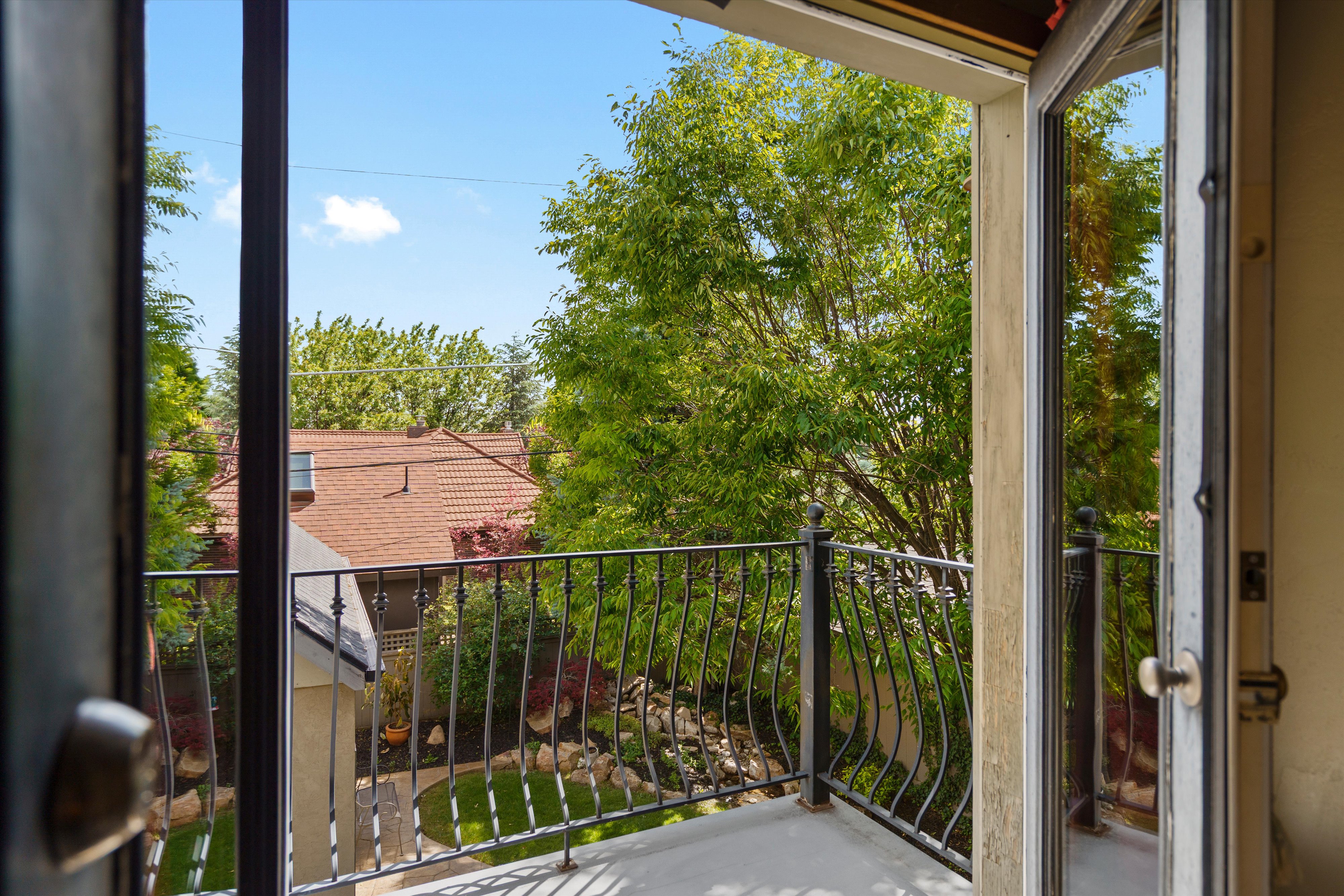 Primary balcony overlooking the back yard
