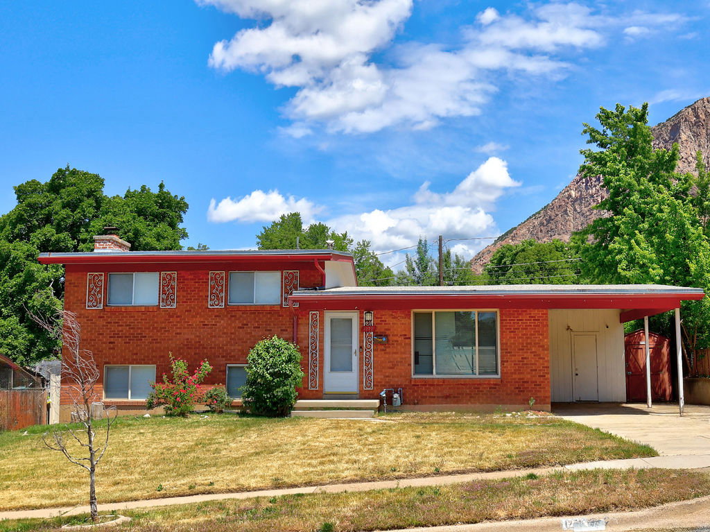 Brick exterior with a red roofline and white trim