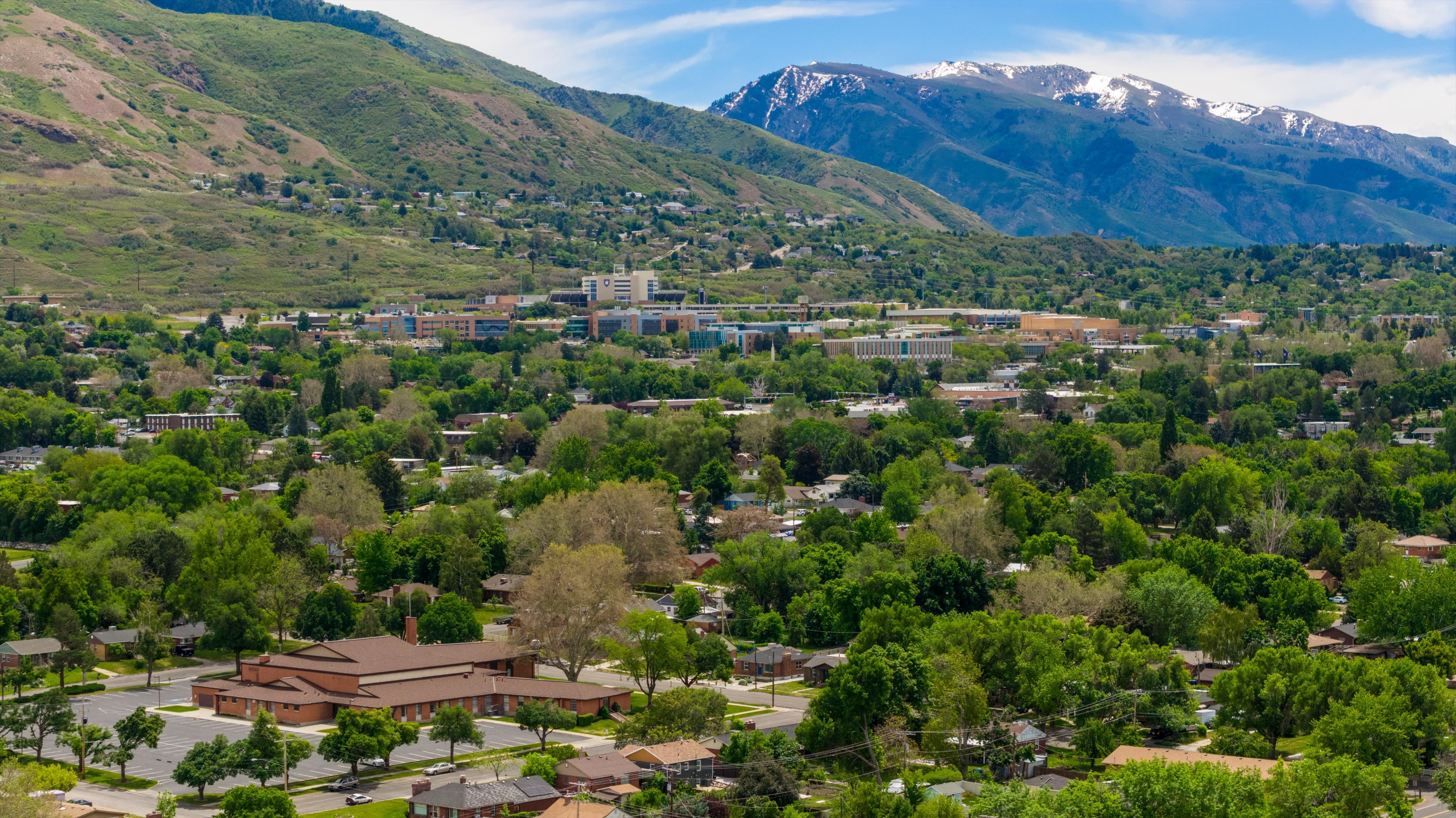 Expansive mountain backdrop with snow-capped peaks