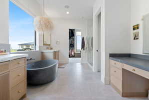 Freestanding soaking tub with a large picture window