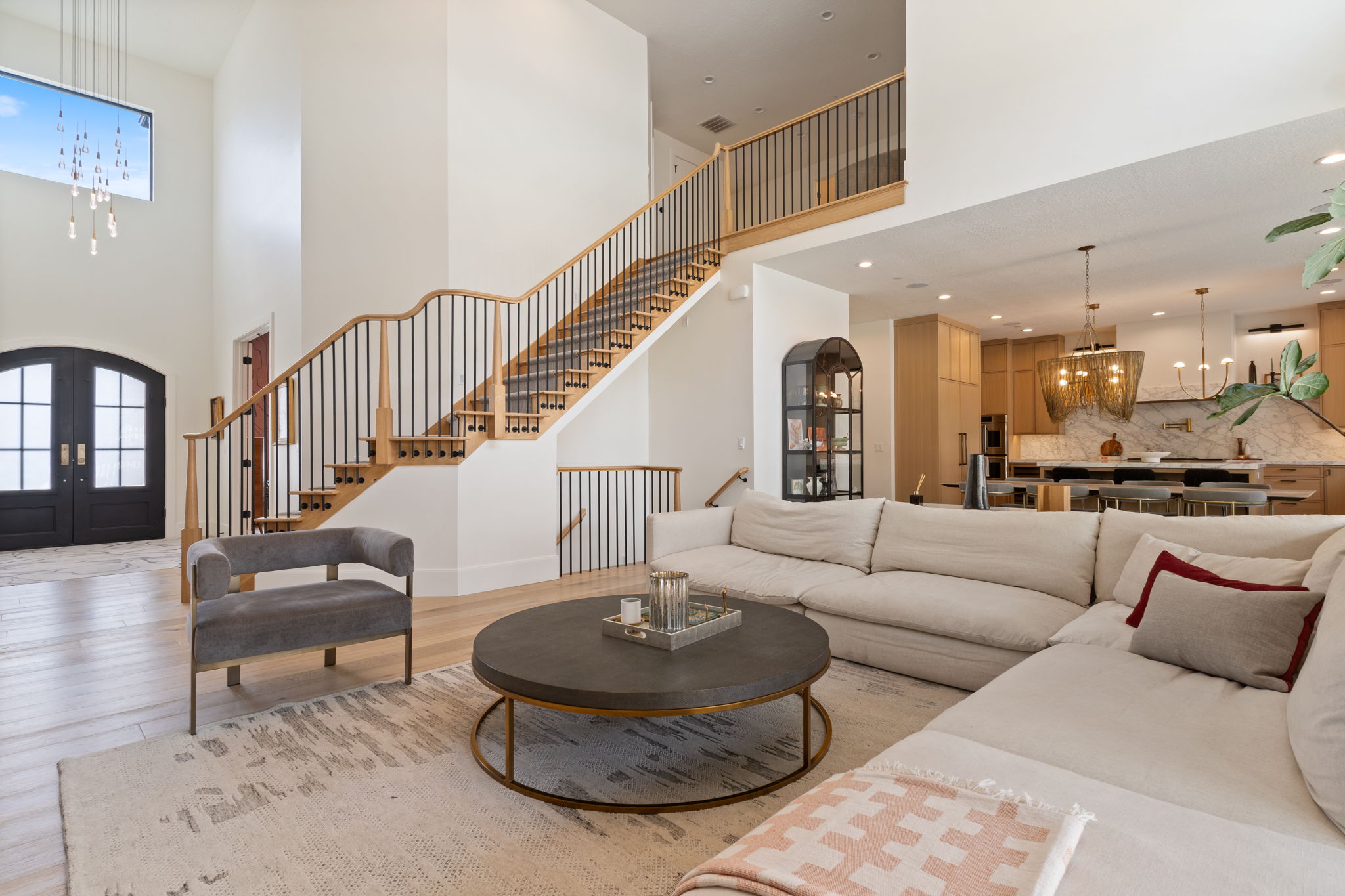 Two-story foyer with natural wood-finish flooring