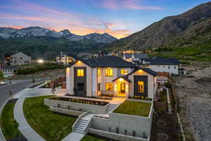Contemporary residence featuring a striking stone and stucco facade