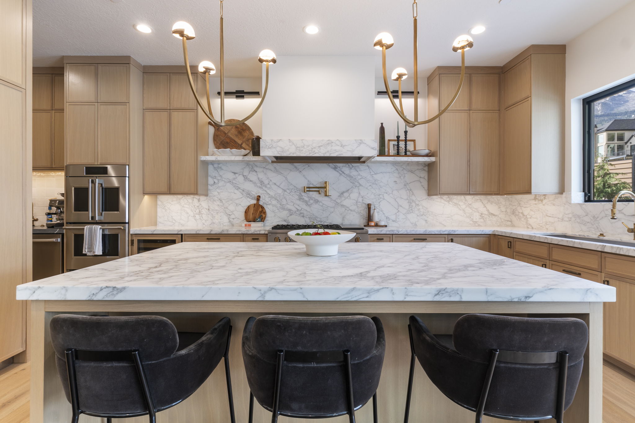 Expansive kitchen island featuring a marble countertop