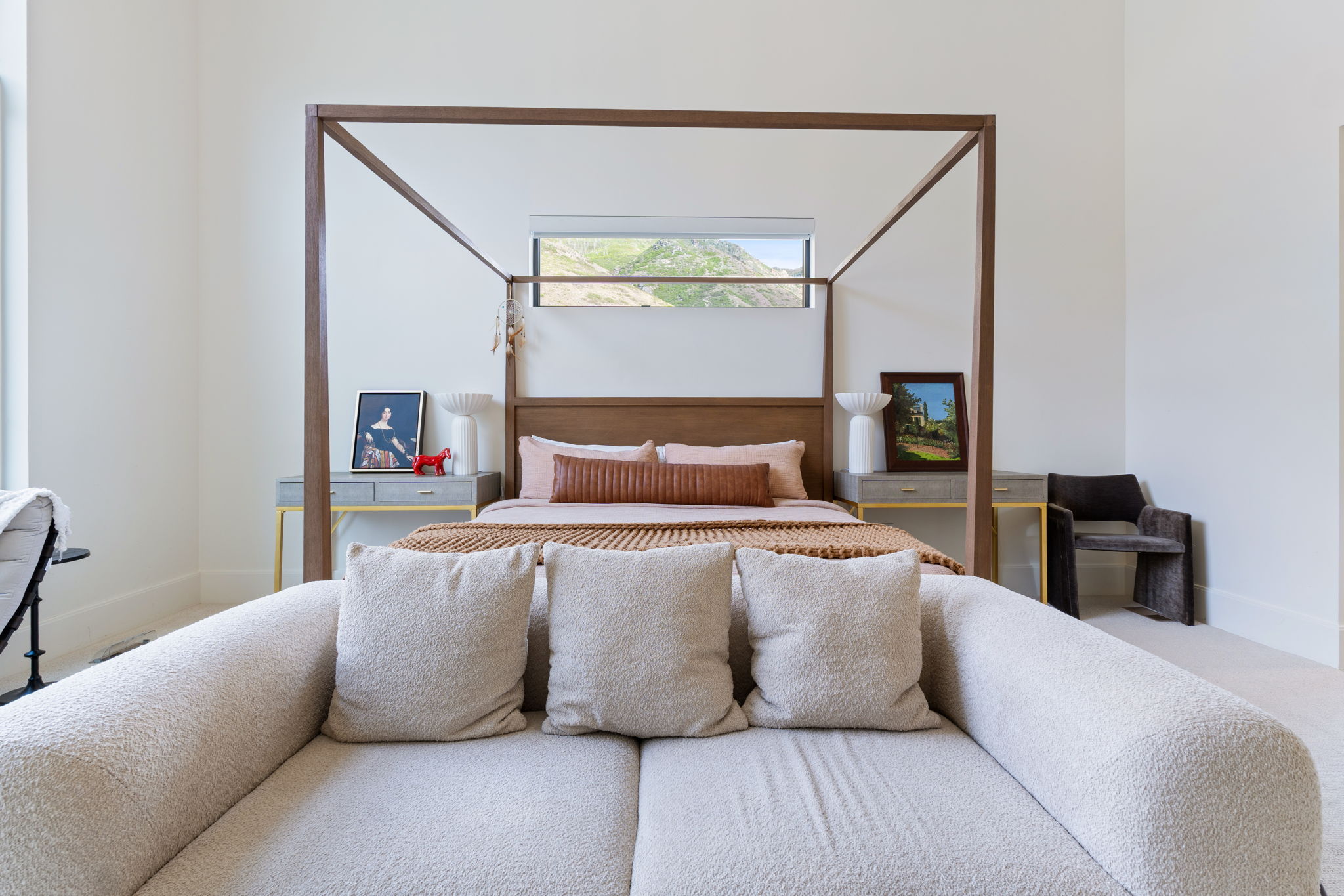 Spacious room featuring high ceilings and light-colored walls